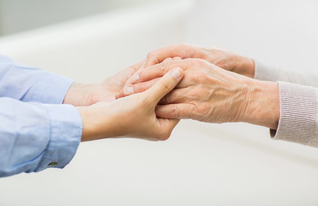 close up image of young and old hands