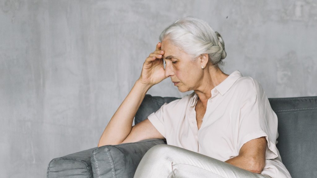 Elderly woman looking depressed