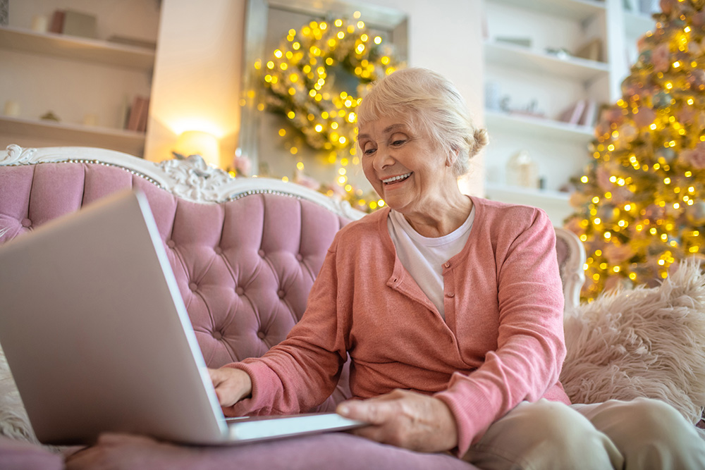 Senior woman having a video call and smiling nicely