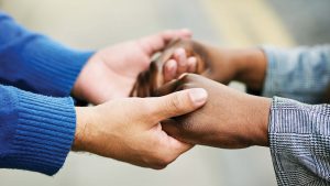 "Two people holding hands"