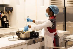 ADP staff prepare lunch for clients