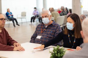 ADP clients participate in a game of cards