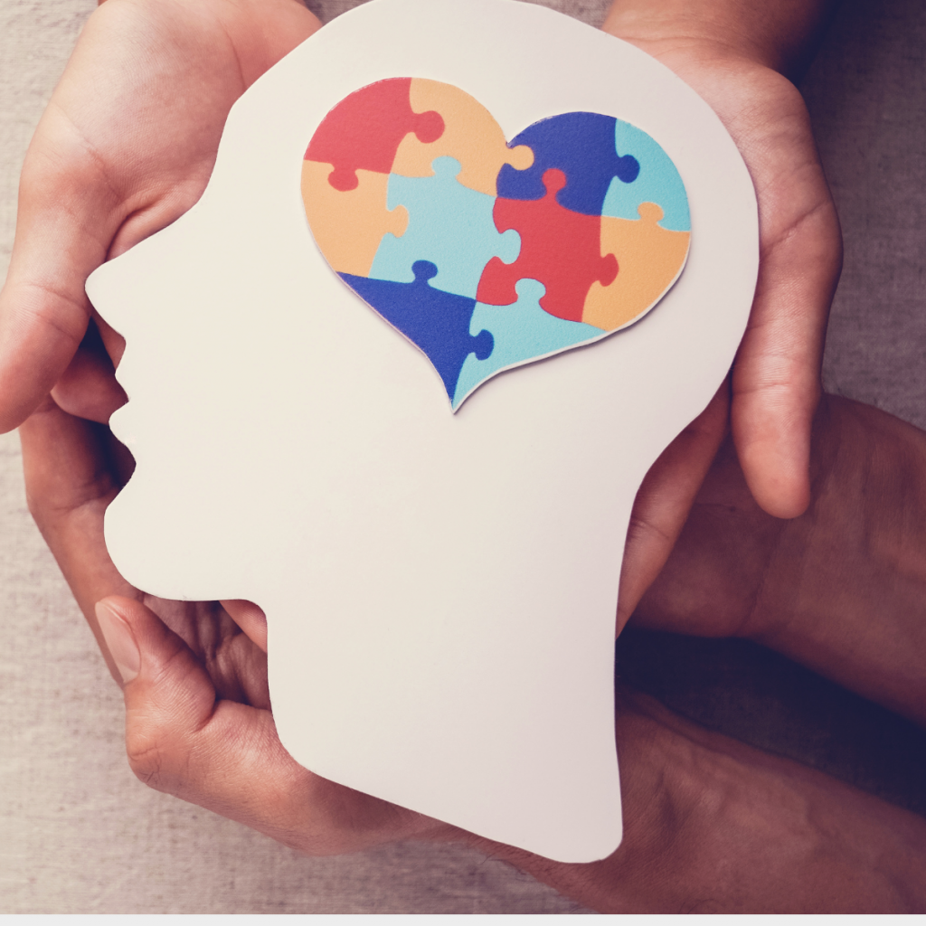 close up of hands holding an image of a mind