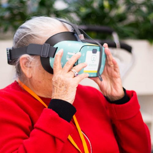 Adult Day Program client uses Rendever virtual reality headset.