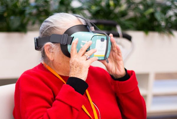 Adult Day Program client uses Rendever virtual reality headset.