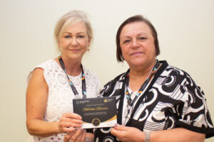 CEO Carey Lucki presents Valentina with her Champions of Care award.