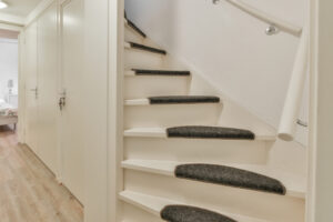 "staircase with treads in hallway"