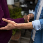 "hands holding each other support"