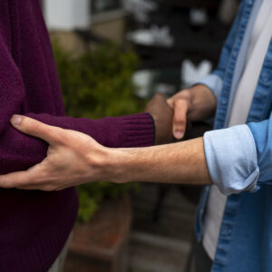 "hands holding each other support"
